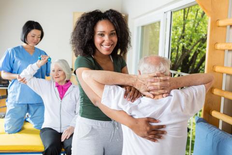 GBO Physical therapist helps patient with range of motion exercises